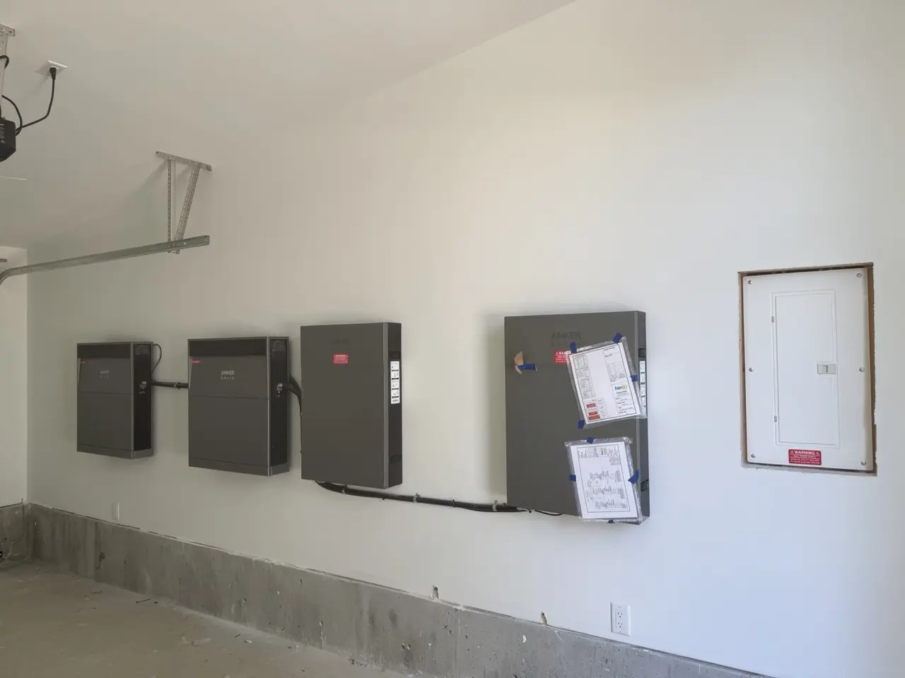 Wall-mounted modular battery system at the E11 Vancouver residence